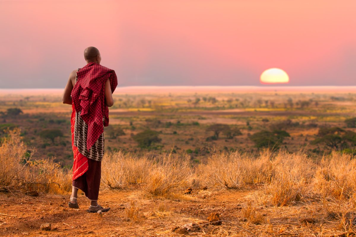 Masai,Warrior,Looks,Out,Over,Serengeti,At,Sunset